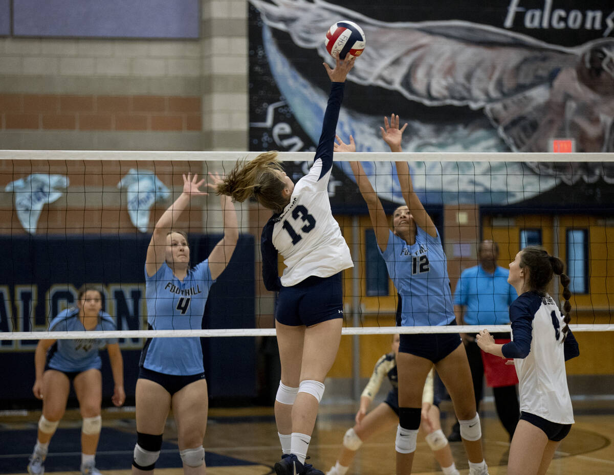 Shadow Ridge's Riah Thurston (13) makes a hit during their match against Foothill High School o ...