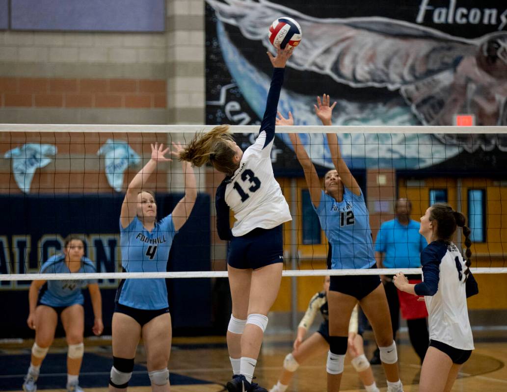 Shadow Ridge's Riah Thurston (13) makes a hit during their match against Foothill High School o ...