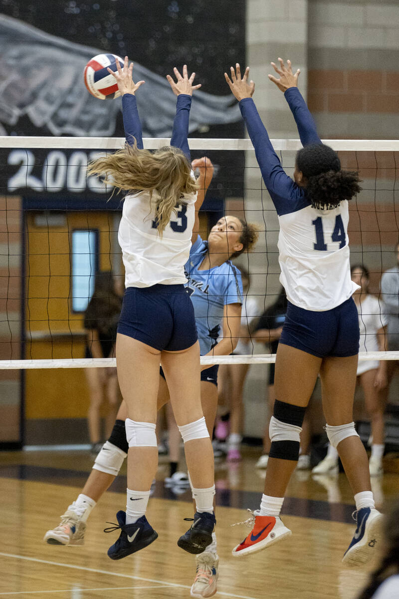 Shadow Ridge's Riah Thurston (13) makes a block during their match against Foothill High School ...