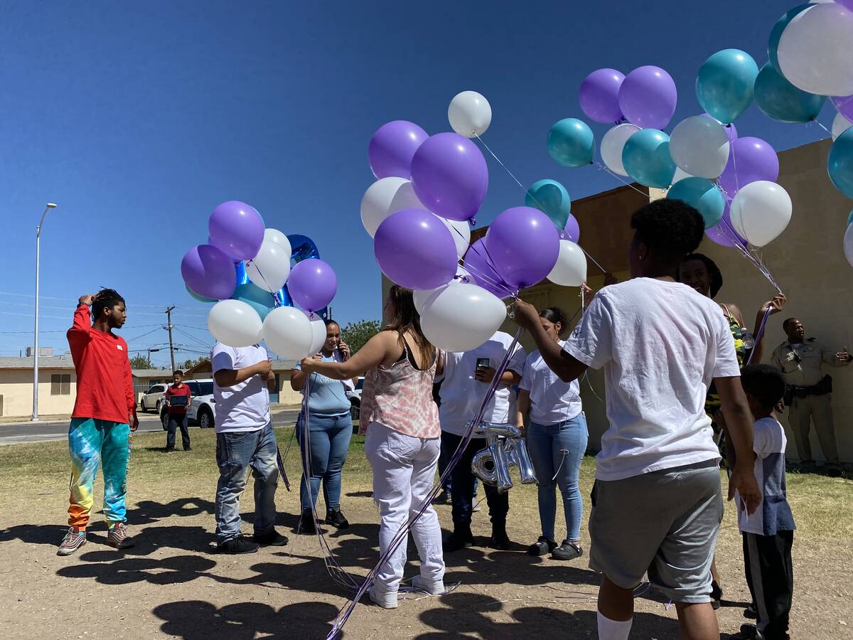 Family of Makayla Adams and community members prepare to release balloons into the sky outside ...