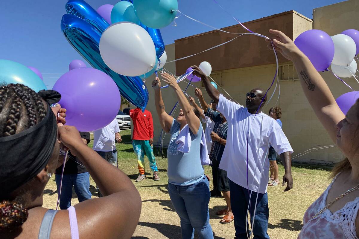 Makayla Adams' parents Monica and Donald Miner release balloons into the sky outside the Marble ...