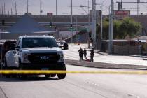 Police investigate the scene on East Charleston where a cyclist was killed Friday morning on Fr ...