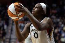 Las Vegas Aces guard Jackie Young (0) shoots against the Connecticut Sun during the second half ...