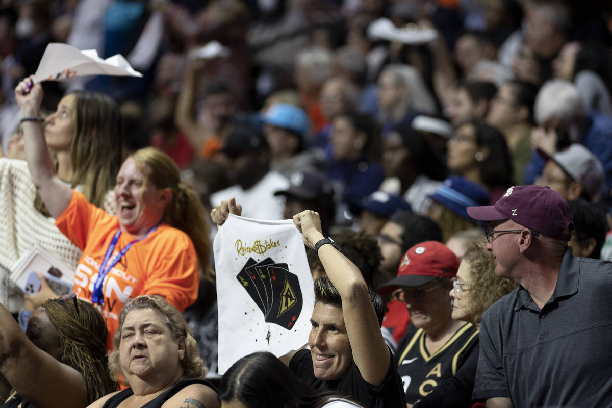 Las Vegas Aces fans cheer among a crowd of majority Connecticut Sun fans during the second half ...