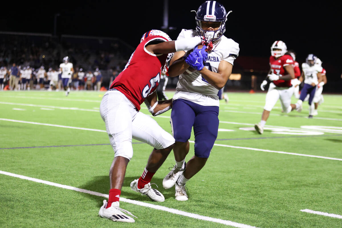 Liberty's Emarion Jones (51) pushes Kamehameha Kapalama's Chavis Lee (8) out of bounds in the f ...