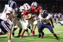 Liberty's Colin Gregorio (4) runs the ball for a touchdown in the first half of a football game ...