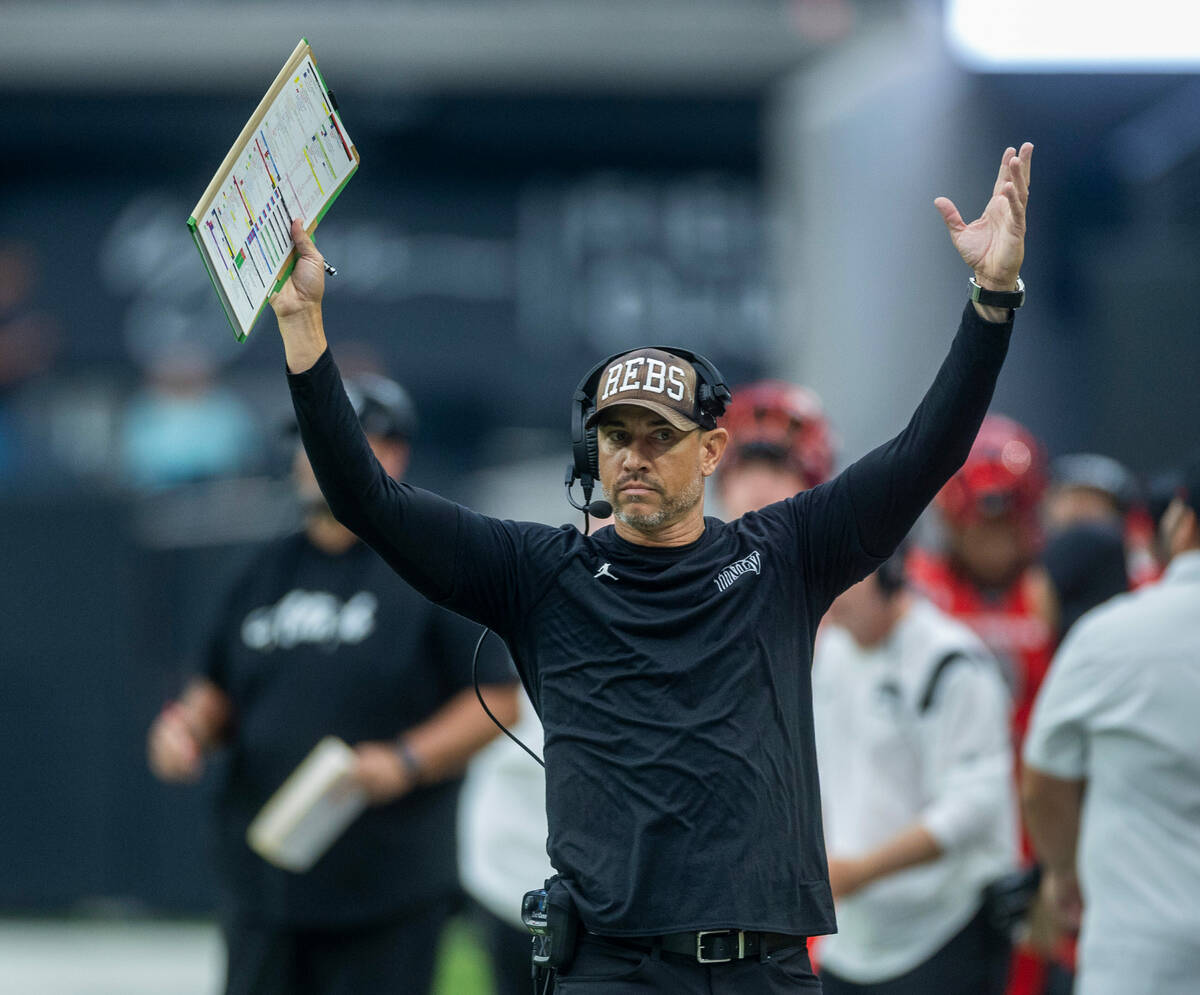 UNLV Rebels head coach Marcus Arroyo signals touchdown over the North Texas Mean Green during t ...