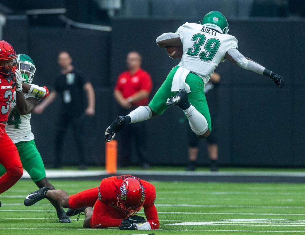 UNLV Rebels defensive back Jordyn Morgan (25) upends North Texas Mean Green running back Ayo Ad ...