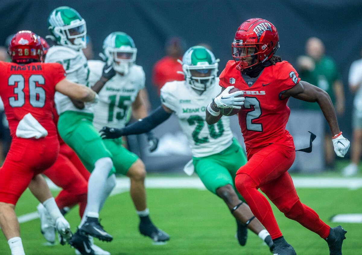 UNLV Rebels quarterback Doug Brumfield (2) breaks free on his way to another long run versus th ...