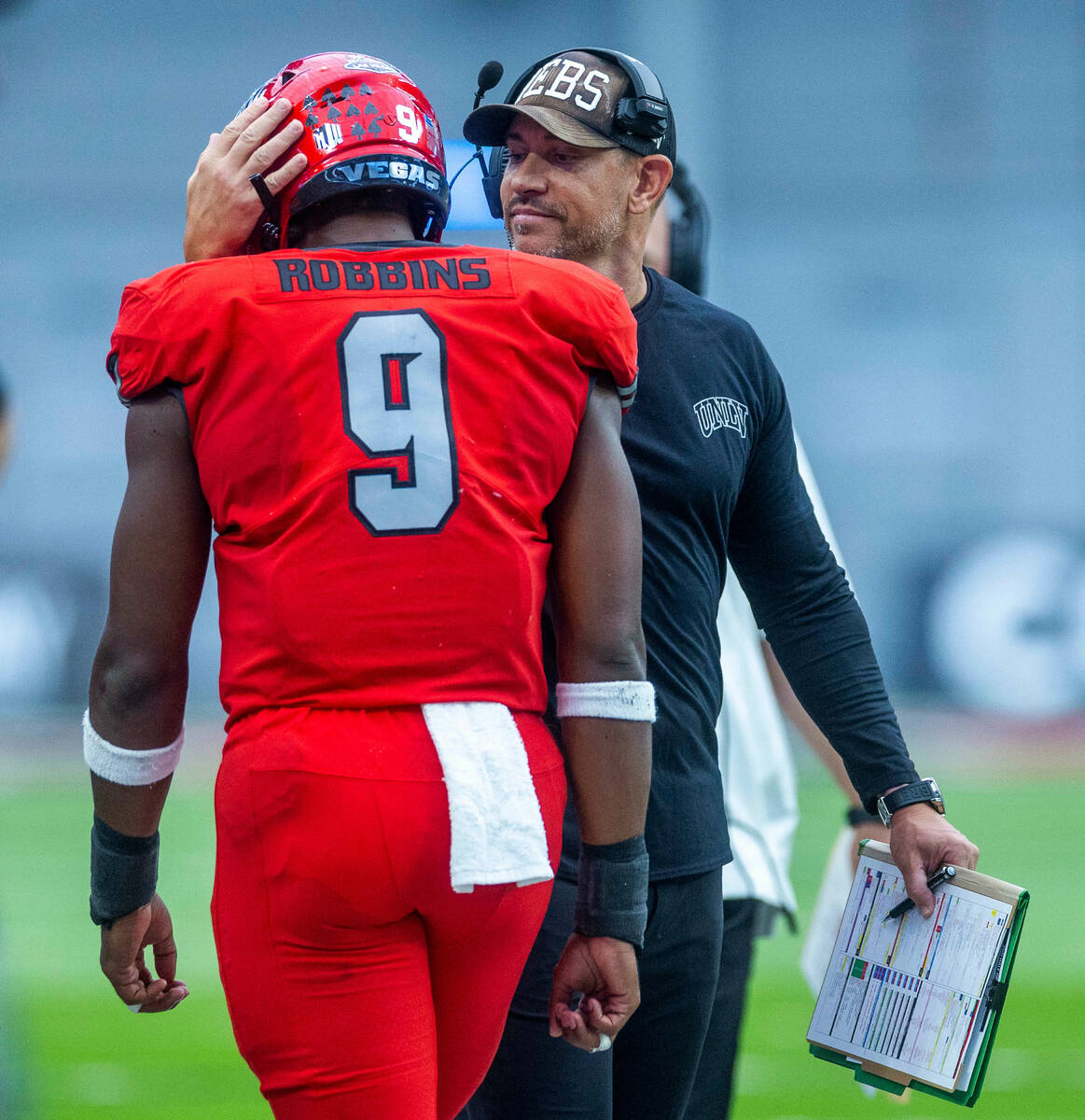 UNLV Rebels running back Aidan Robbins (9) is congratulated on another score by UNLV Rebels Hea ...