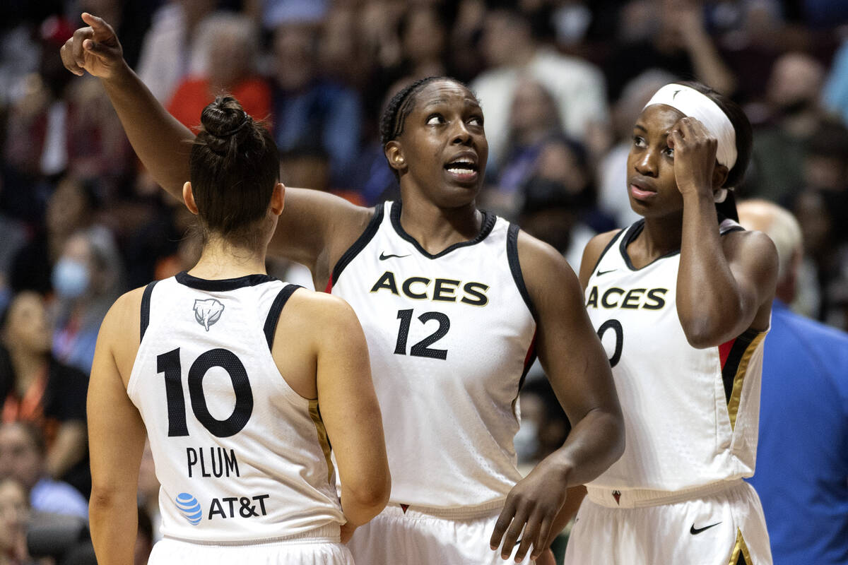 Las Vegas Aces guard Chelsea Gray (12) communicates with teammates guard Kelsey Plum (10) and g ...