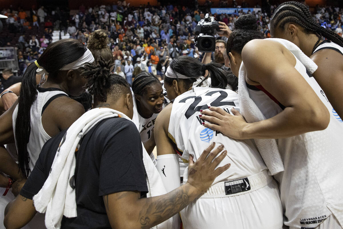 Las Vegas Aces guard Chelsea Gray, center left, speaks to her team after losing Game 3 of a WNB ...