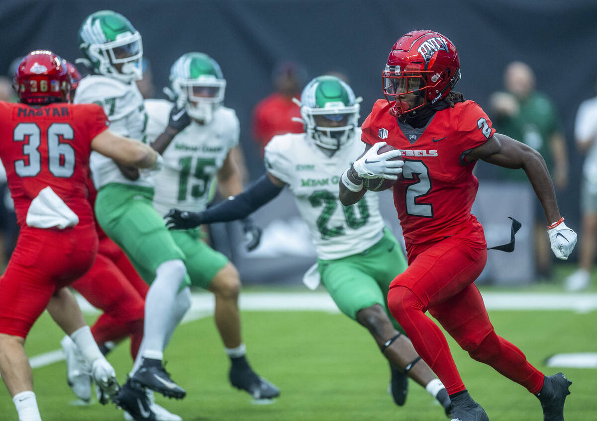 UNLV Rebels quarterback Doug Brumfield (2) breaks free on his way to another long run versus th ...