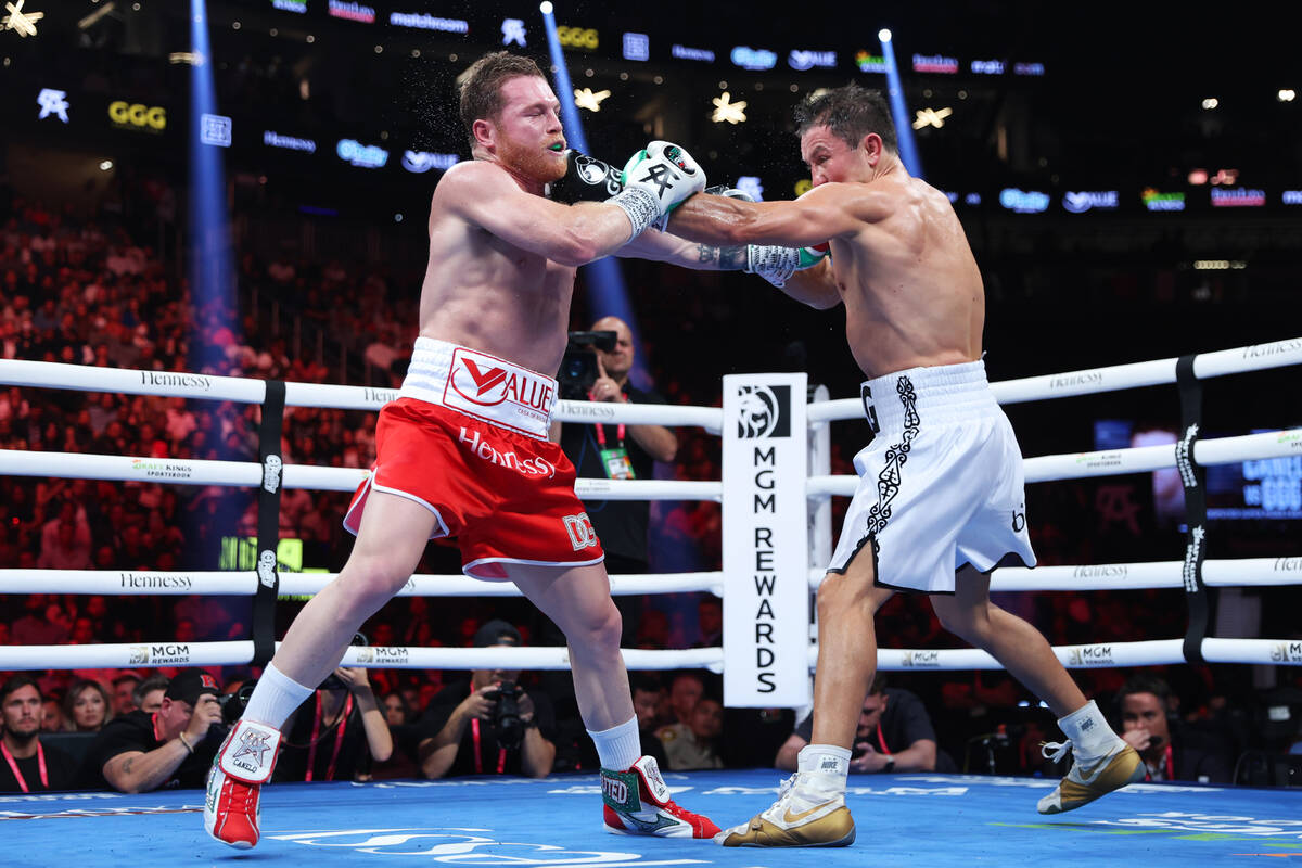 Saul "Canelo" Alvarez, left, exchanges punches with Gennadiy "GGG" Golovkn, ...