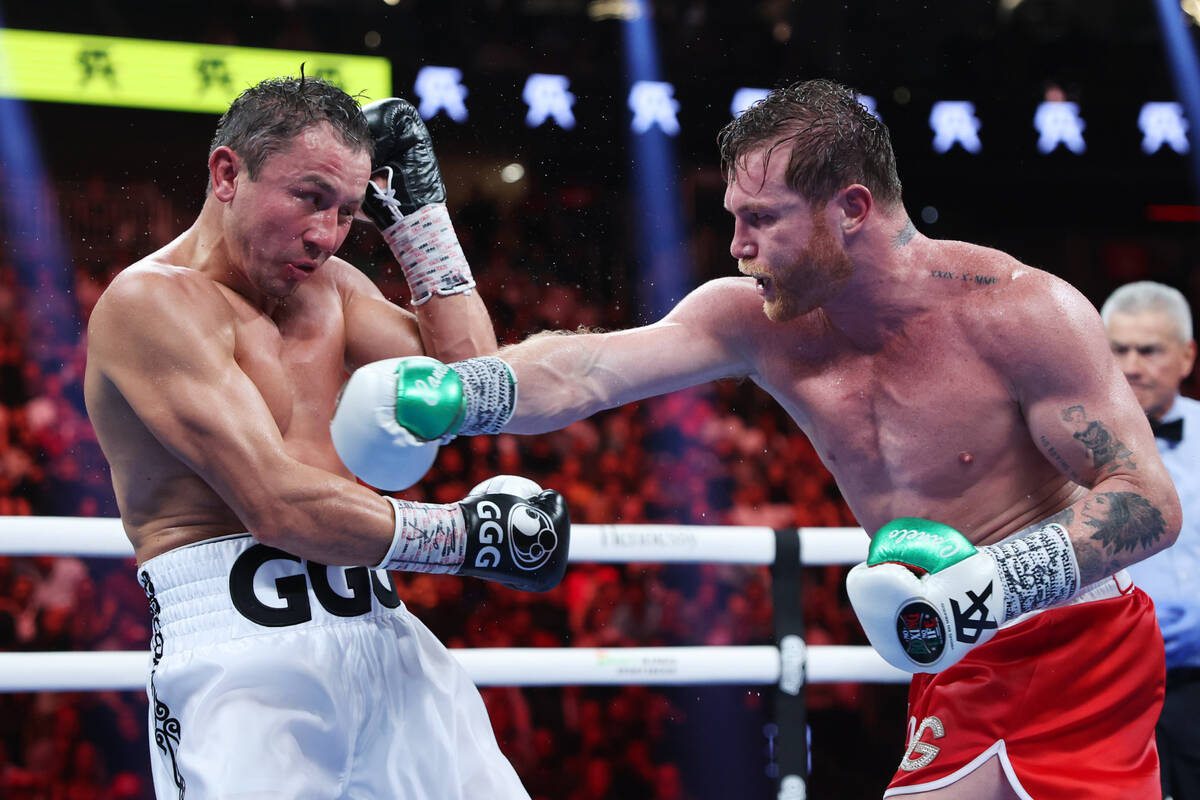 Saul "Canelo" Alvarez, right, throws a punch against Gennadiy "GGG" Golovki ...