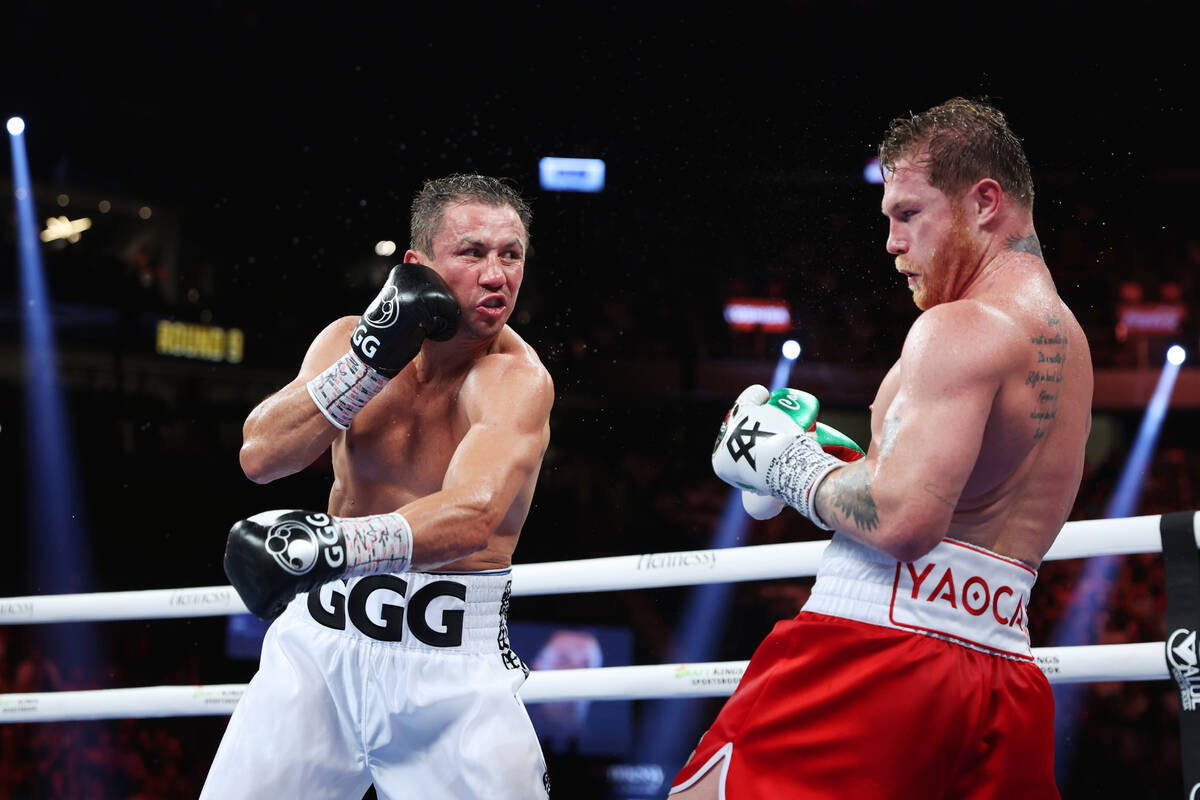 Saul "Canelo" Alvarez, right, dodgers a punch from Gennadiy "GGG" Golovkin, ...