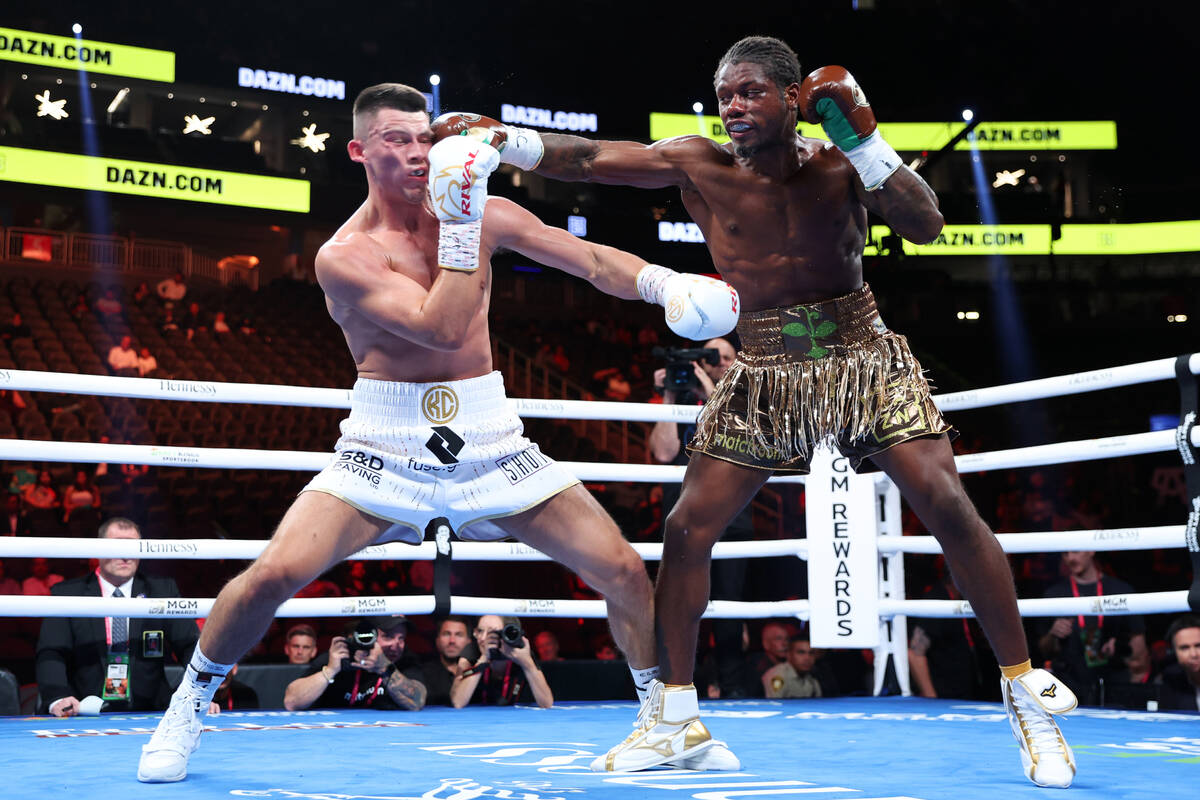 Austin Williams, right, connects a punch against Kieron Conway, in the fourth round of a middle ...