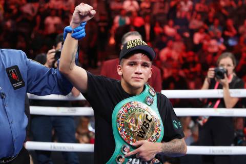 Jesse "Bam" Rodriguez, right, raises his arm in victory after his unanimous decision victory ag ...