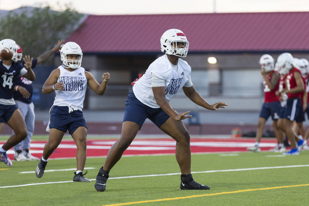 Ed Haynes runs a drill during a team football practice at Liberty High School in Henderson, Mon ...