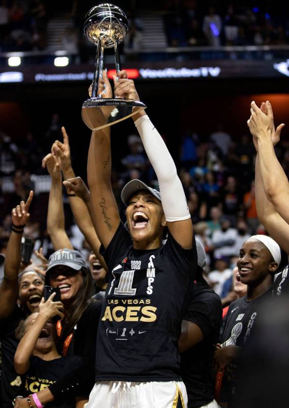 Las Vegas Aces forward A'ja Wilson (22), the 2022 WNBA MVP, holds up the WNBA Championship trop ...