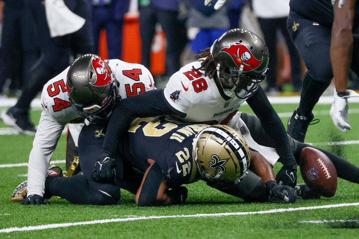 Tampa Bay Buccaneers linebacker Lavonte David and safety Logan Ryan force a fumble by New Orlea ...