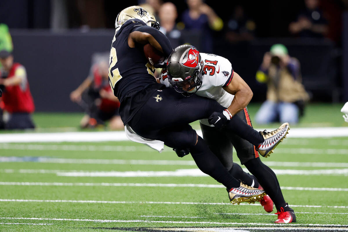 New Orleans Saints running back Mark Ingram II is tackled by Tampa Bay Buccaneers safety Antoin ...