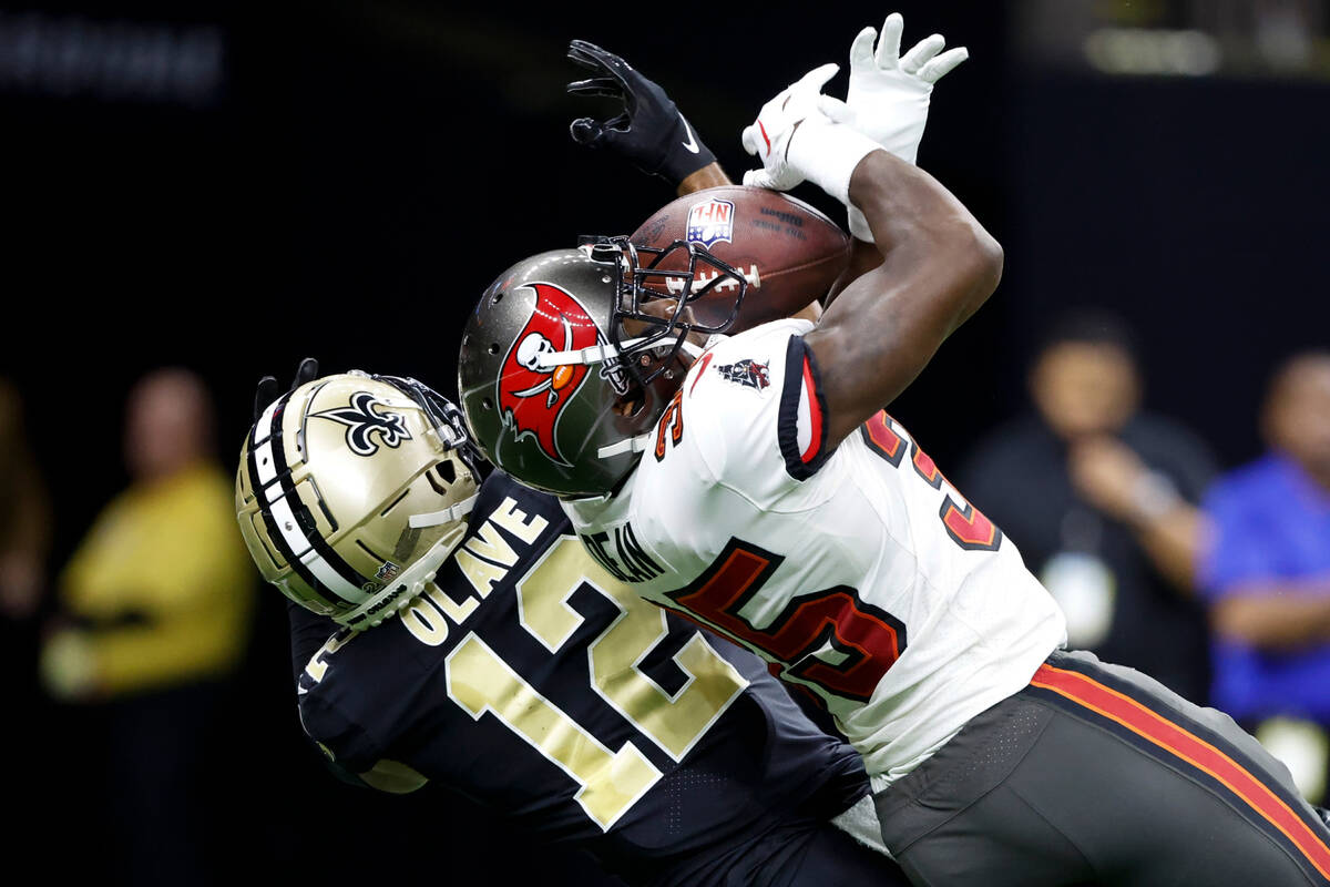 Tampa Bay Buccaneers cornerback Jamel Dean intercepts a pass intended for New Orleans Saints wi ...