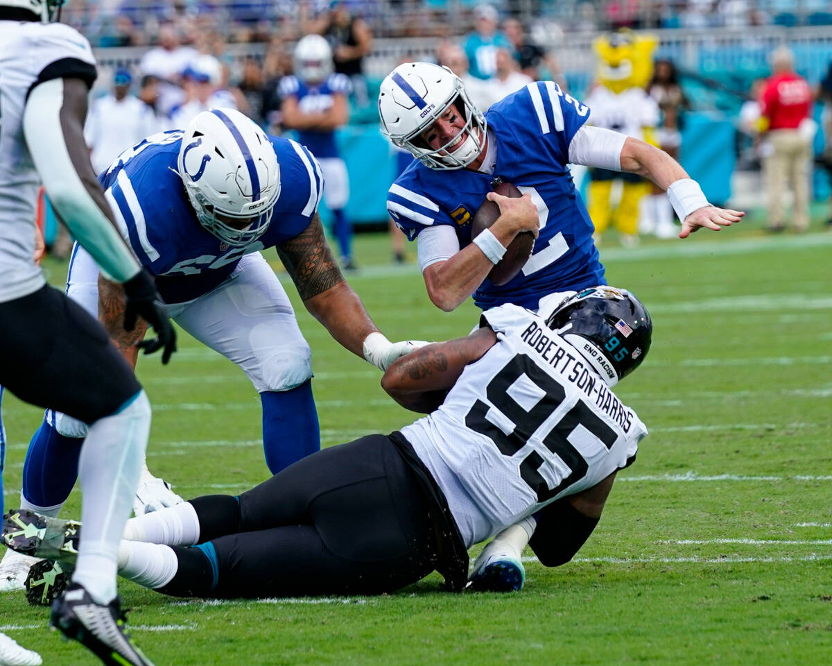 Indianapolis Colts quarterback Matt Ryan (2) is sacked by Jacksonville Jaguars defensive end Ro ...