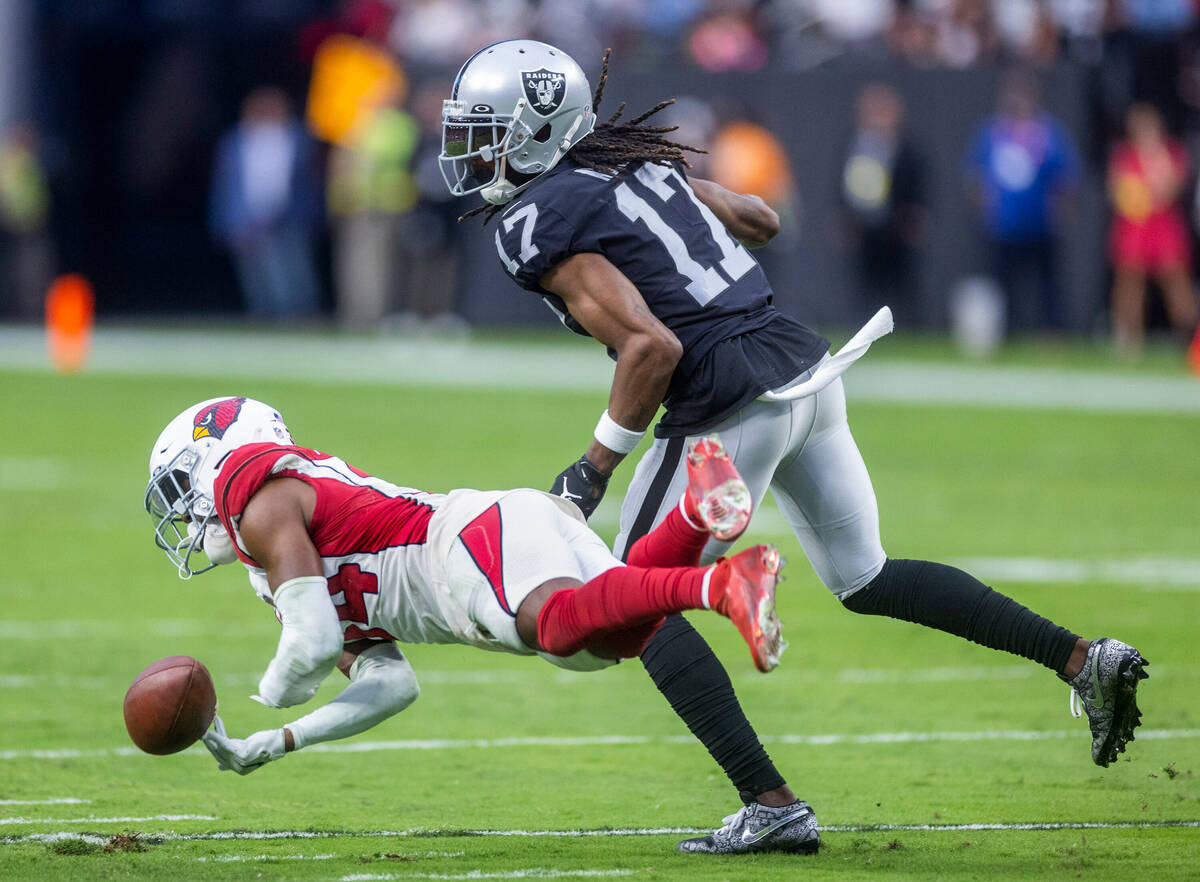 Arizona Cardinals safety Jalen Thompson (34) nearly intercepts a pass intended for Raiders wide ...