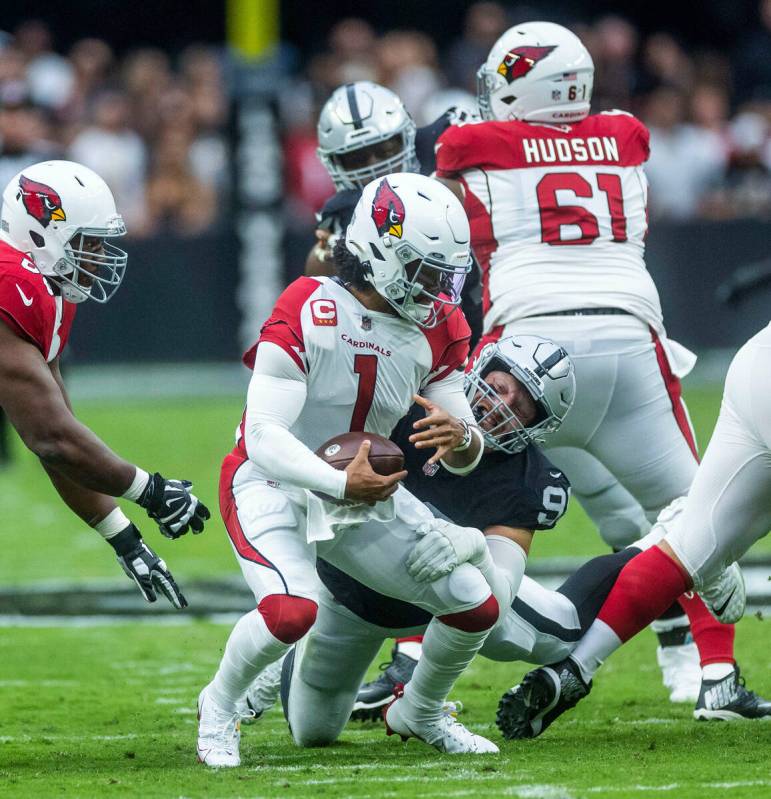 Arizona Cardinals quarterback Kyler Murray (1) is sacked by Raiders defensive end Maxx Crosby ( ...