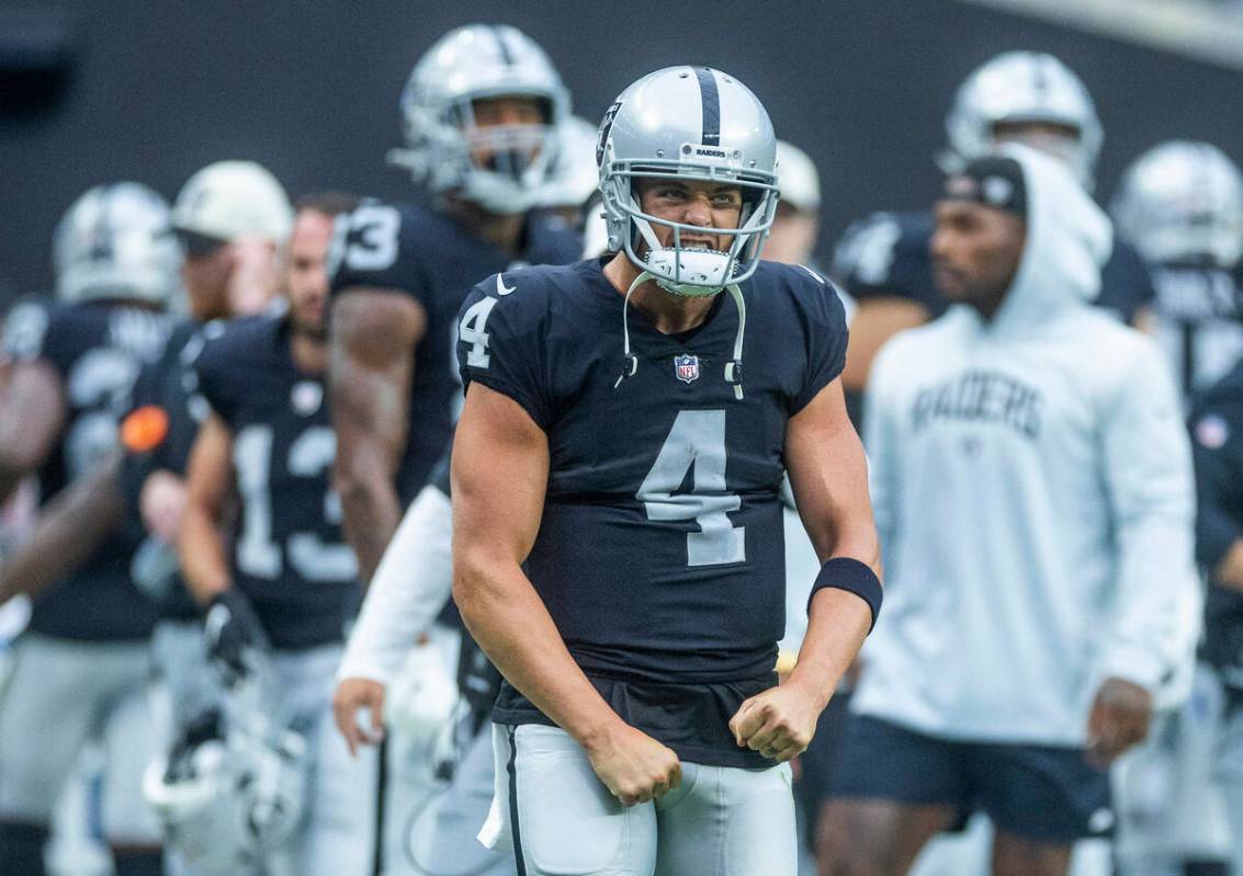 Raiders quarterback Derek Carr (4) celebrates the first score of the game versus Arizona Cardin ...