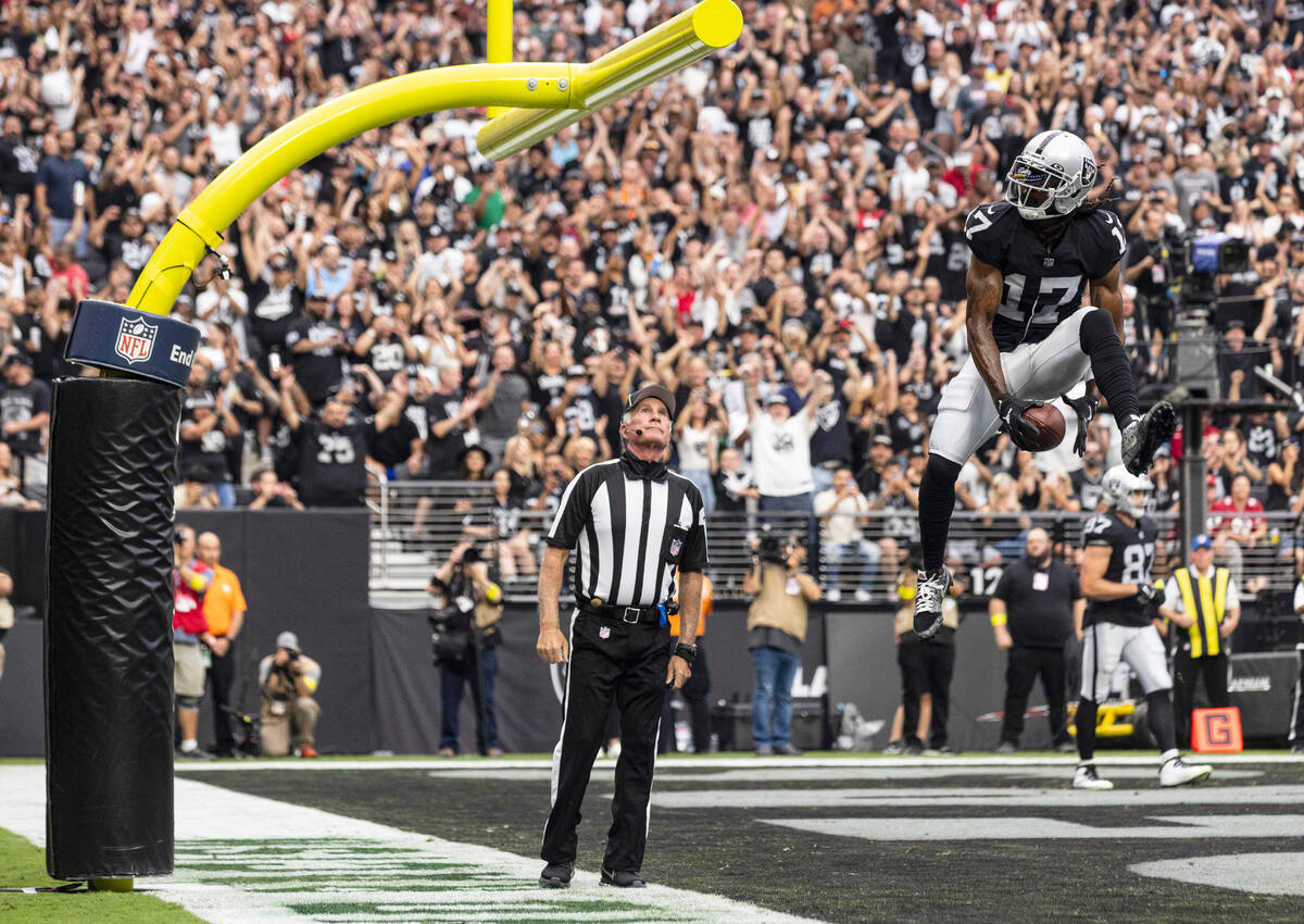 Las Vegas Raiders wide receiver Davante Adams (17) celebrates after scoring a touchdown against ...