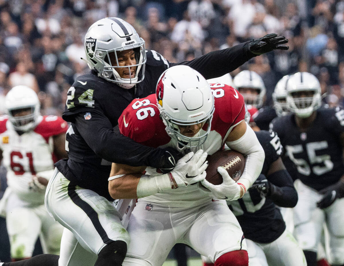 Arizona Cardinals tight end Zach Ertz (86) drives against Raiders safety Johnathan Abram (24) ...