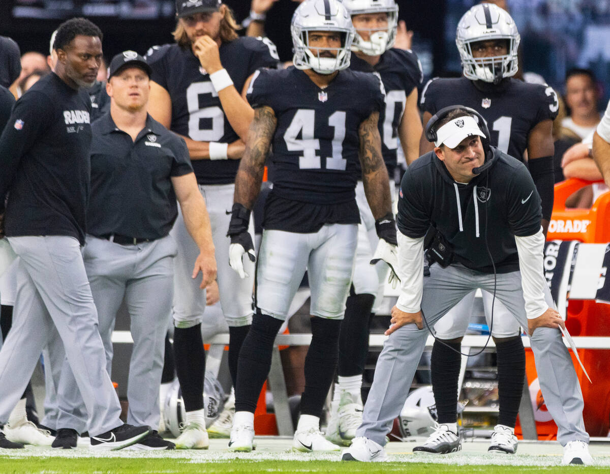 Raiders head coach Josh McDaniels watches the game from the sideline during the first half on a ...