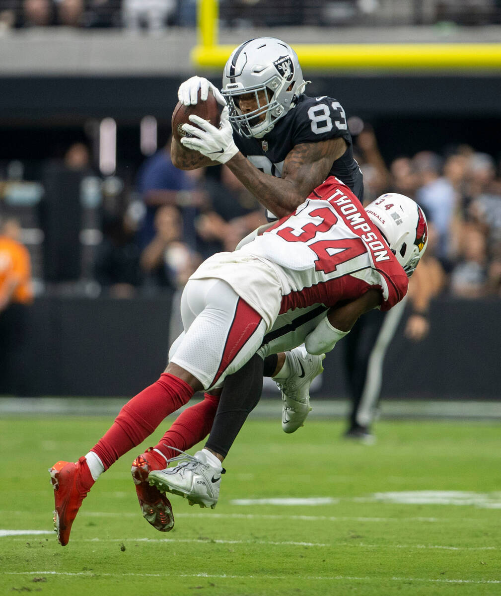 Raiders tight end Darren Waller (83) makes a catch as he is tackled by Arizona Cardinals safety ...