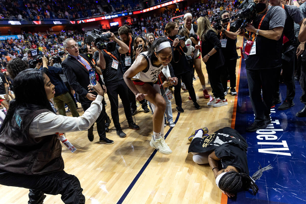 Las Vegas Aces forward A'ja Wilson fakes putting guard Sydney Colson to sleep after they won th ...