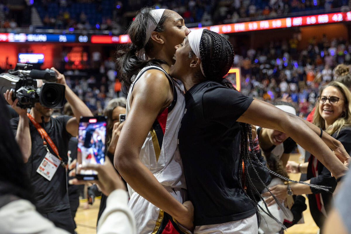 Las Vegas Aces forward A'ja Wilson and guard Sydney Colson celebrate after winning the 2022 WNB ...