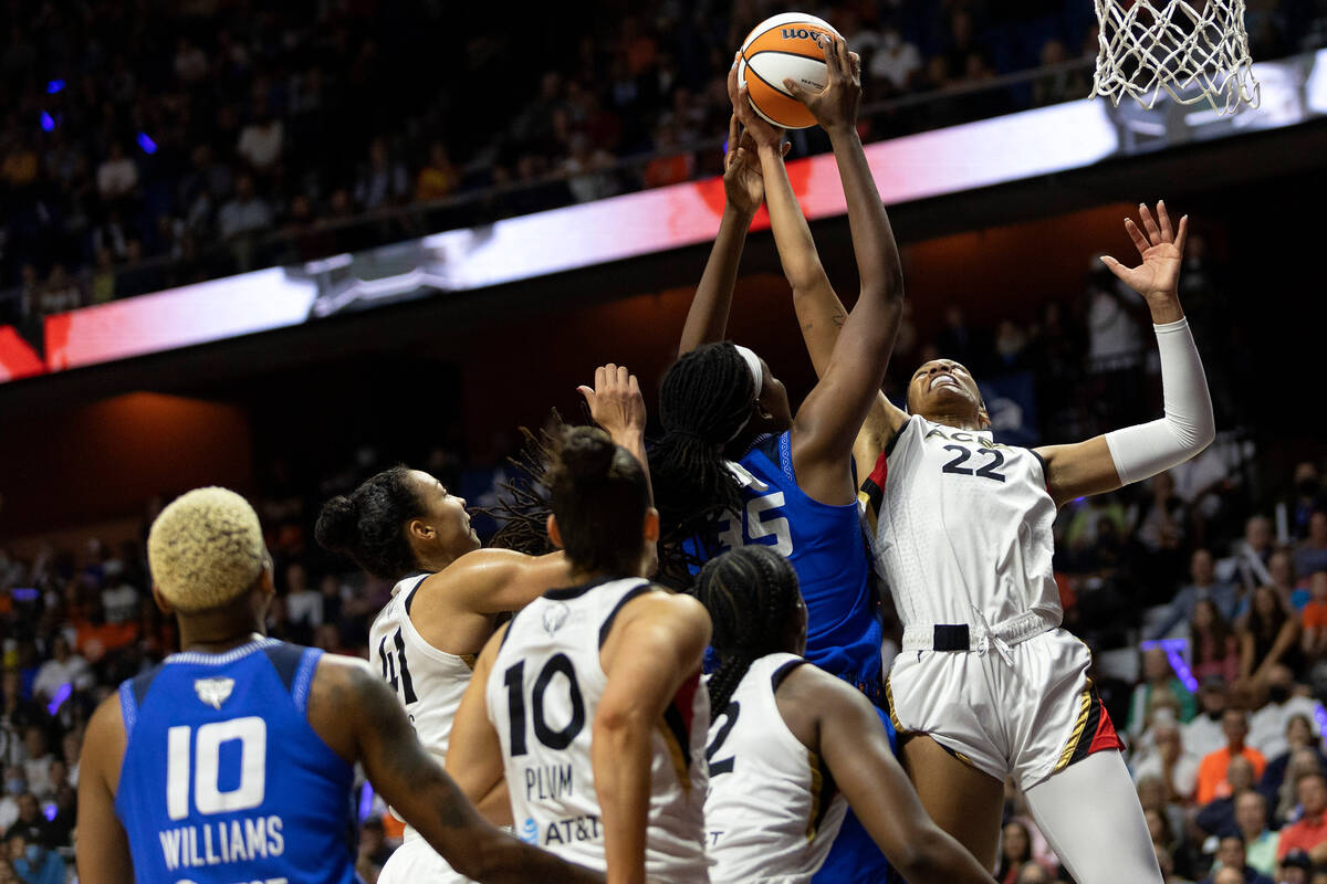 Las Vegas Aces forward A'ja Wilson (22) thwarts a shot by Connecticut Sun forward Jonquel Jones ...