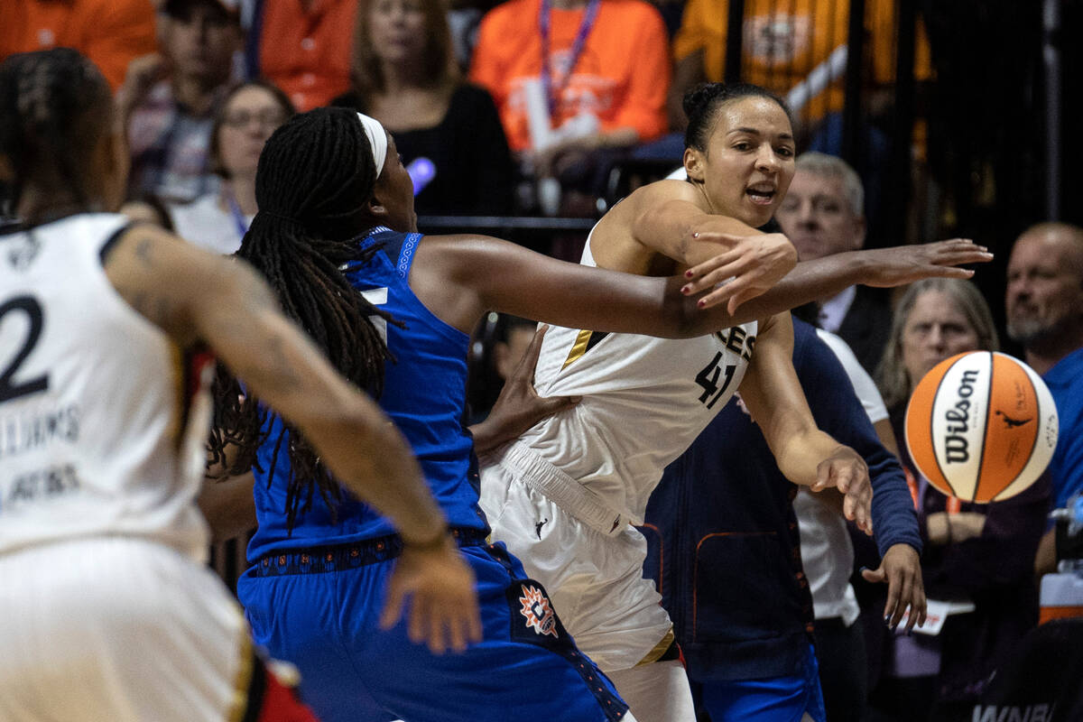 Las Vegas Aces center Kiah Stokes (41) passes to guard Riquna Williams (2) around Connecticut S ...