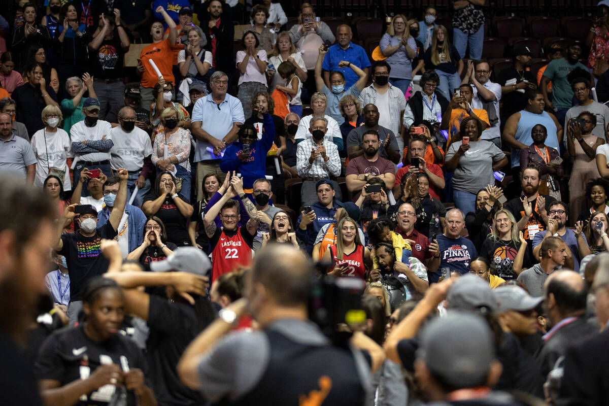 Las Vegas Aces fans move to the front of the crowd to watch their team receive the 2022 WNBA Ch ...