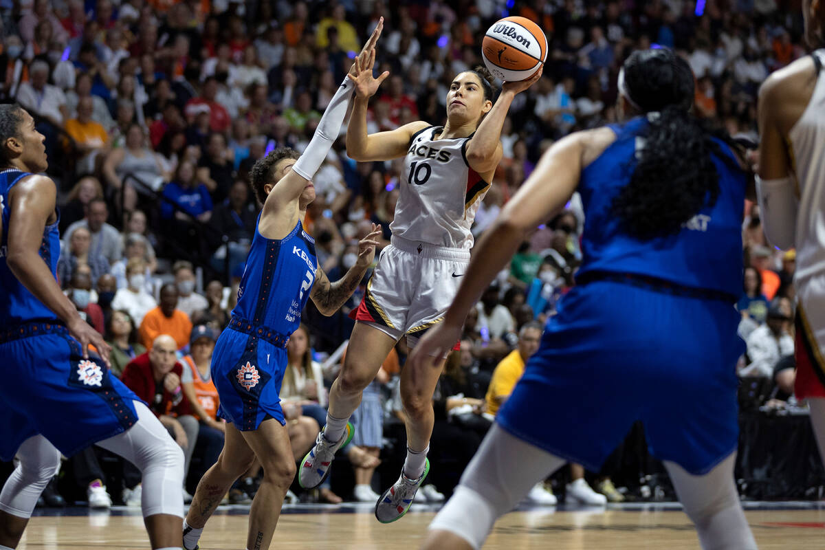 Las Vegas Aces guard Kelsey Plum (10) jumps to shoot against Connecticut Sun guard Natisha Hied ...