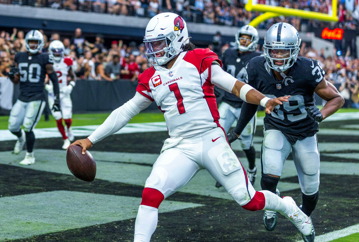 Arizona Cardinals quarterback Kyler Murray (1) scampers into the end zone past Raiders cornerba ...