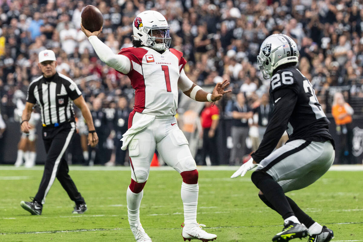 Arizona Cardinals quarterback Kyler Murray (1) throws the ball as Las Vegas Raiders cornerback ...