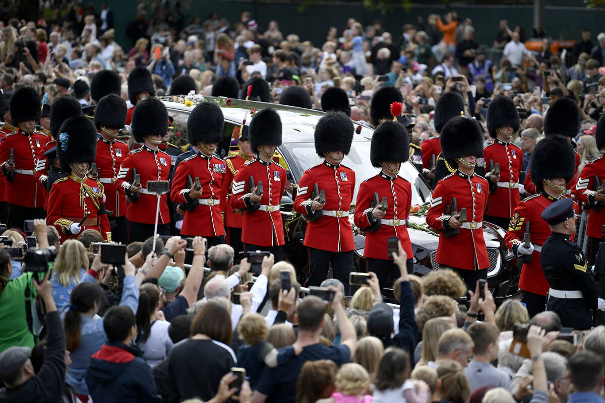 The state hearse carrying the coffin of Queen Elizabeth II, draped in the royal standard with t ...