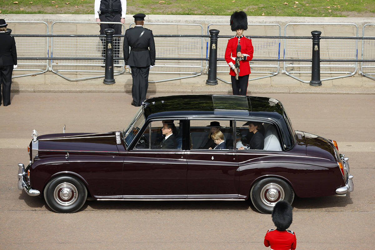 Britain's Prince George, Princess Charlotte and Kate, Princess of Wales are driven in car along ...