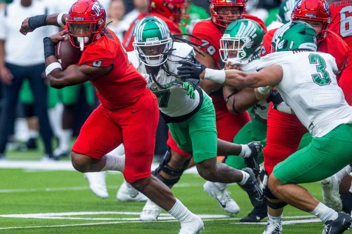 UNLV Rebels running back Aidan Robbins (9) breaks into the open past North Texas Mean Green lin ...
