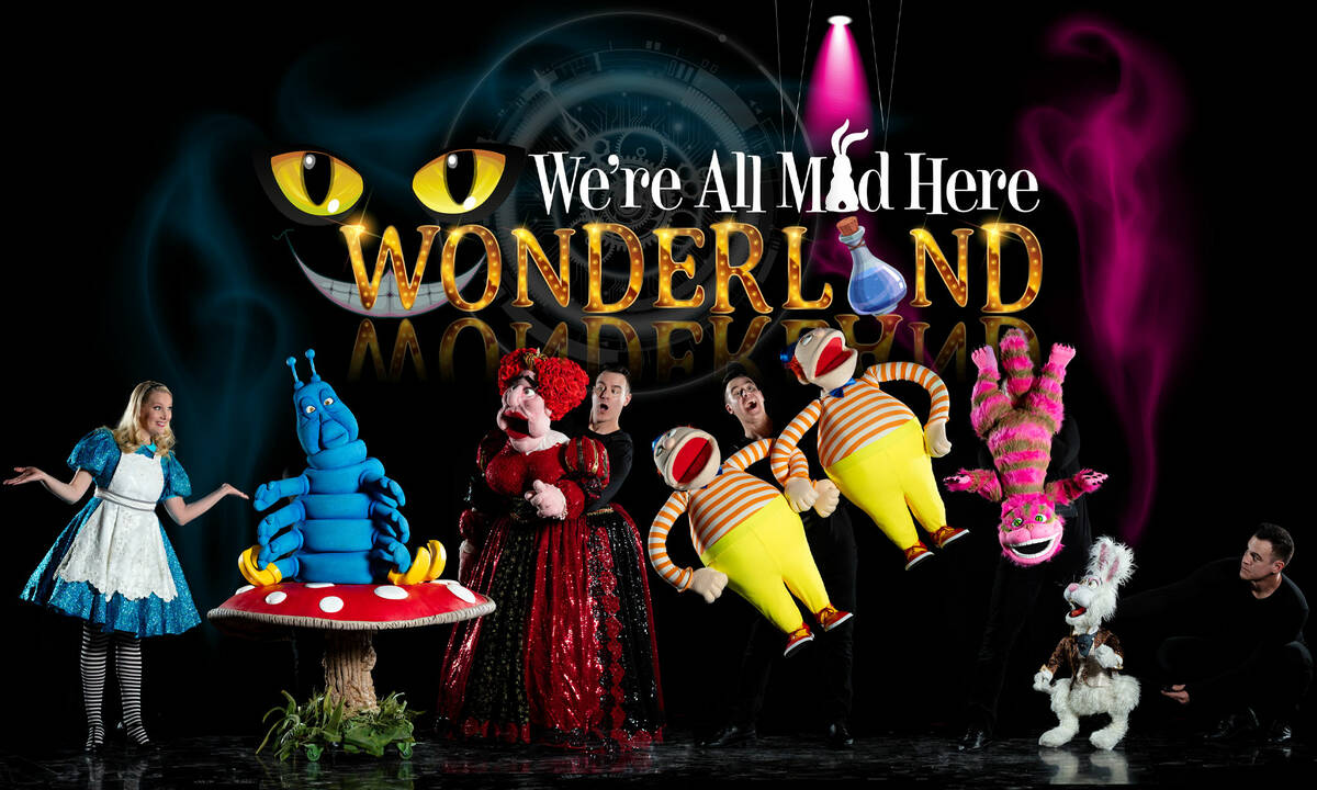 Lauren and Derek Lux are shown in the puppet production "Wonderland," based “Alice’s Advent ...