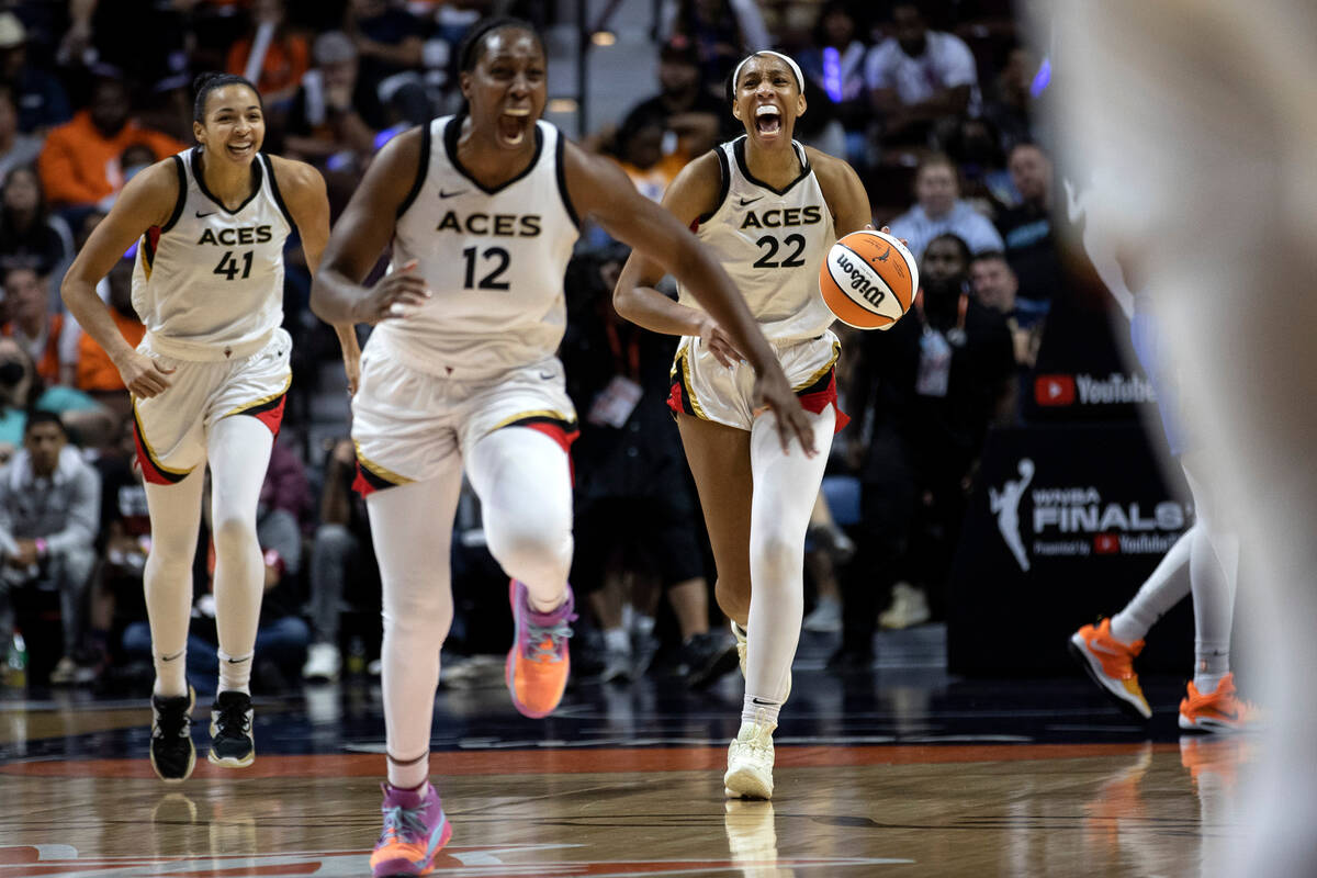 Las Vegas Aces starters Kiah Stokes (41), Chelsea Gray (12) and A’ja Wilson (41) run toward t ...