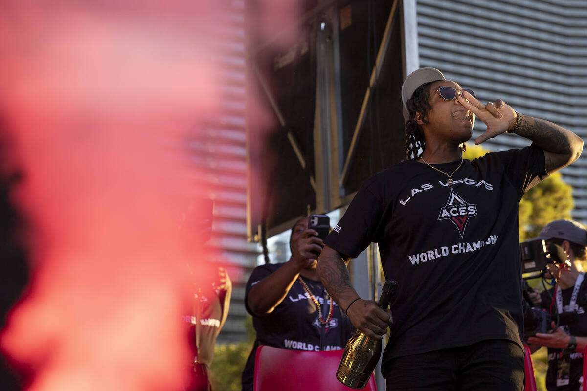 Las Vegas Aces guard Riquna Williams cheers along with the crowd during a parade in honor of th ...
