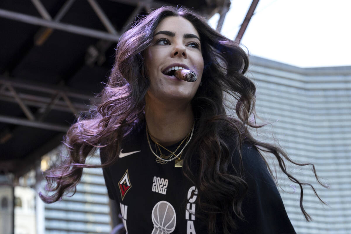 Las Vegas Aces guard Kelsey Plum (10) takes the stage to make a speech during a parade to honor ...
